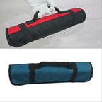 Two views: a gloved hand carrying the rolled red bag, and the rolled blue bag lying flat.