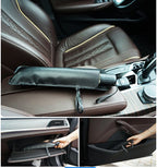 The windshield sun shade rolled into its black storage sleeve and resting on the centre console of a car