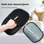 Black pet hair remover mitt worn on the hand with the textured mesh side out, next to a white cat