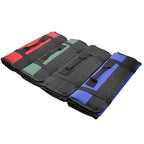 Four rolled tool bags fanned out to show the red, green, black and blue colour options.