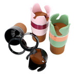 White-background group shot of the cup holder in pink, green, grey and black, with detached rings and base pieces.
