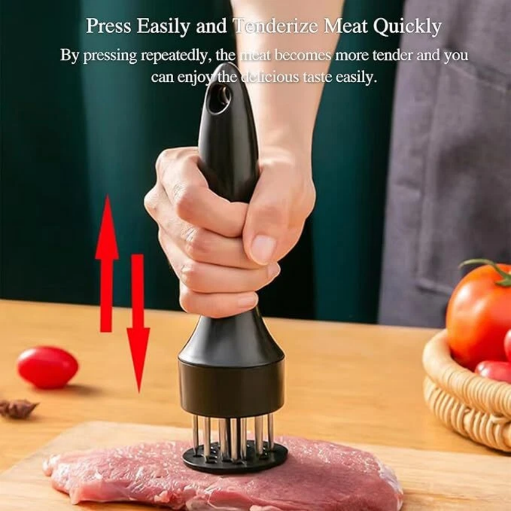 Pressing the tenderizer into a raw steak on a wooden board