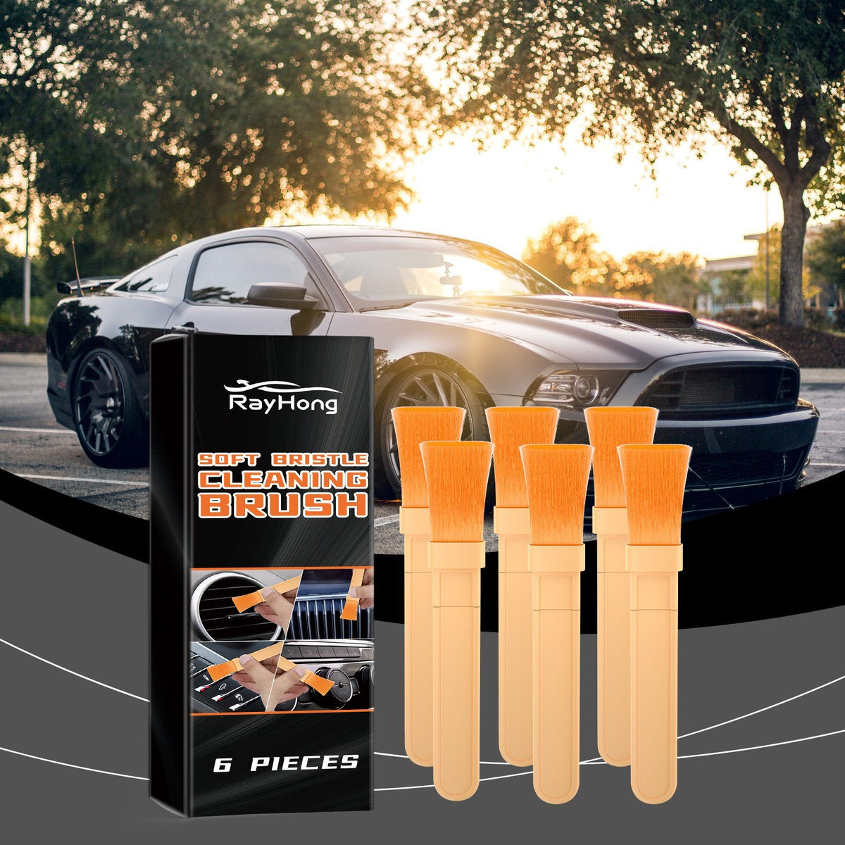 Brush set in the foreground with a black muscle car parked outdoors at sunset behind it.